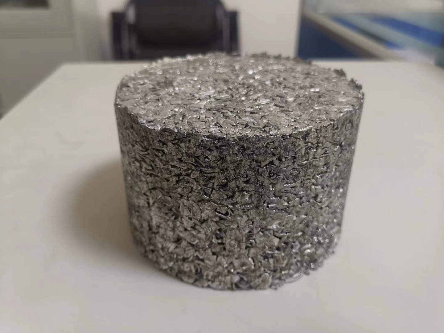 Cylindrical chip briquette supplied as an output-form example