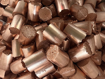 Copper-colored cylindrical metal-chip briquettes